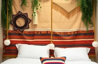 A bedroom showcasing unique fabric and pallet headboards, adorned with tasteful decorations for a cozy aesthetic.