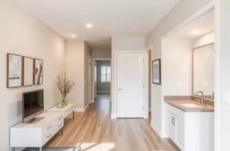 A cozy apartment interior with plants and accessible furniture creating an inviting atmosphere.